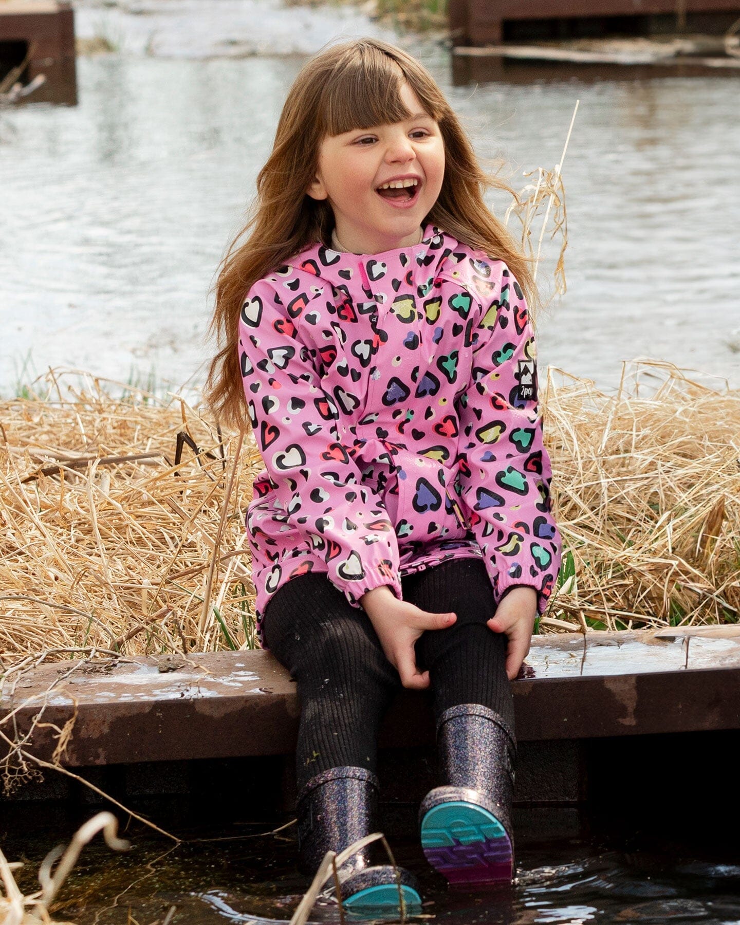 Pink raincoat with color-changing hearts