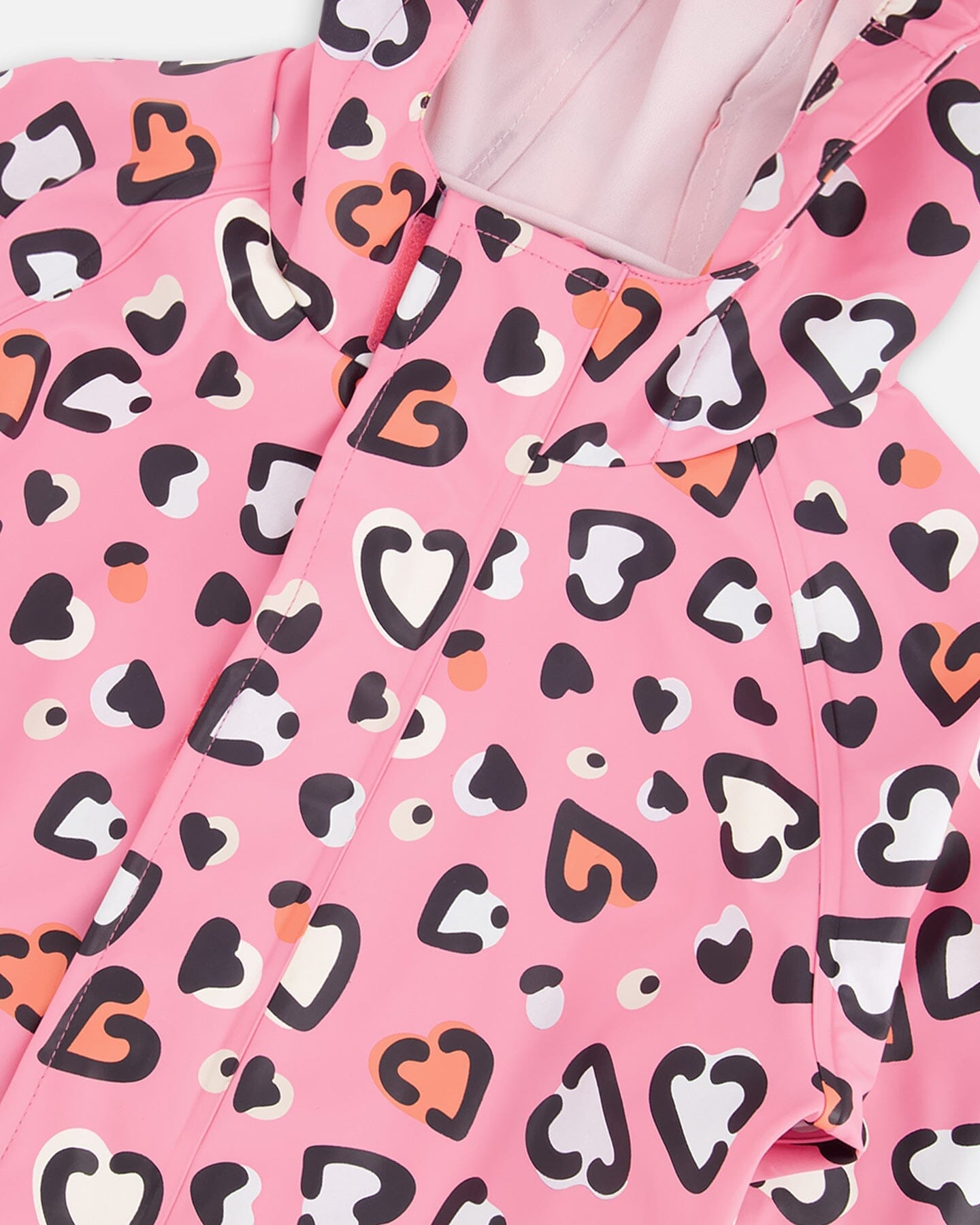 Pink rain jumpsuit with color-changing hearts print