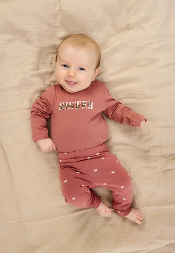 The New Sister Long Sleeve Bodysuit